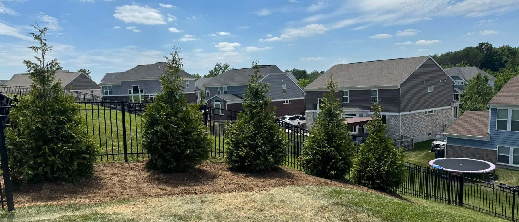 A Northern Kentucky neighbourhood with wooded hills beyond