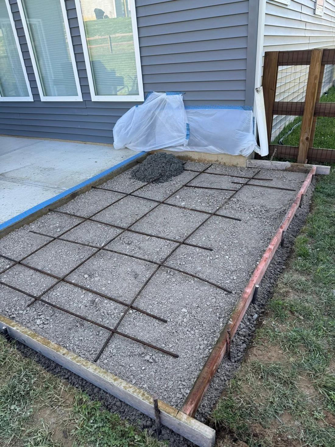 Formed and steel-reinforced concrete pad ready for pour