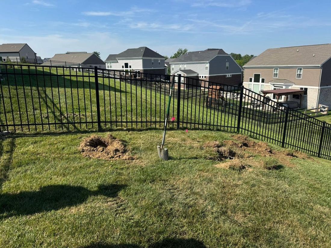 Graded yard along a new fence line