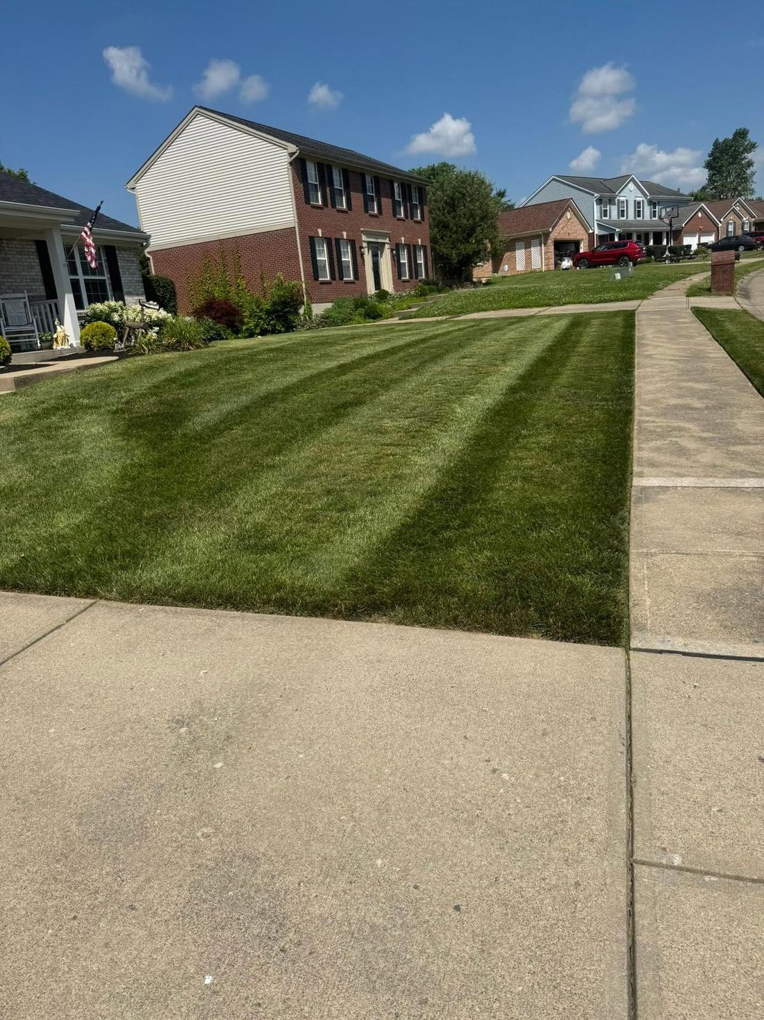 Mowing and edging along the walk